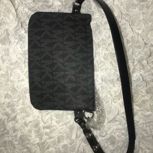 BRAND NEW Micheal Kors large zip clutch.